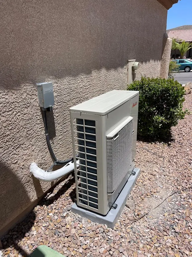 Residential air conditioning condenser unit in Falls